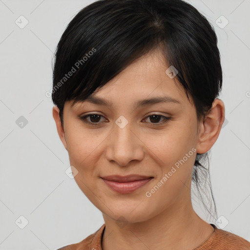 Joyful asian young-adult female with short  brown hair and brown eyes