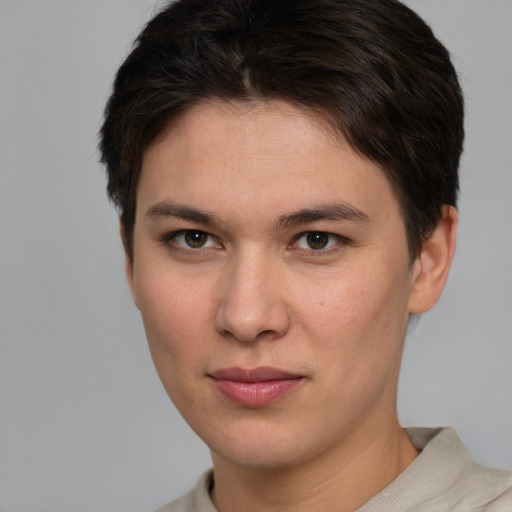 Joyful white young-adult female with short  brown hair and brown eyes