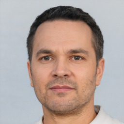 Neutral white adult male with short  black hair and brown eyes