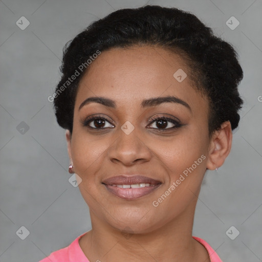 Joyful black young-adult female with short  brown hair and brown eyes