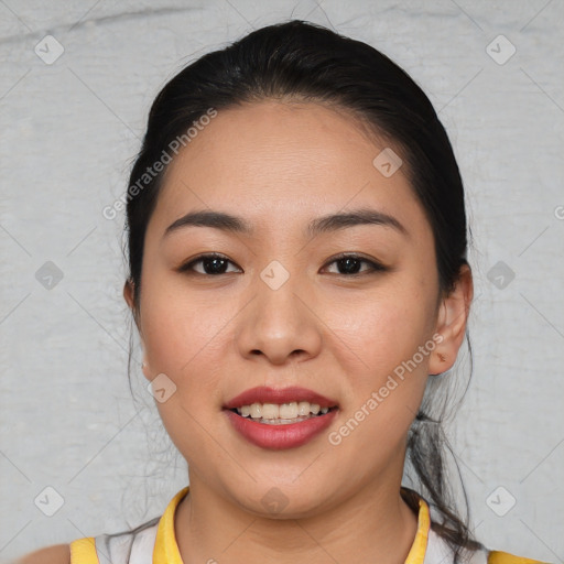 Joyful asian young-adult female with short  brown hair and brown eyes