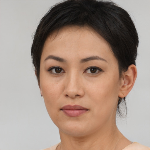 Neutral asian young-adult female with short  brown hair and brown eyes