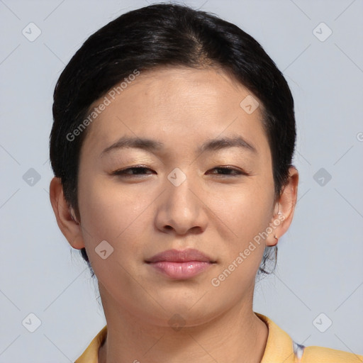 Joyful asian young-adult female with short  brown hair and brown eyes