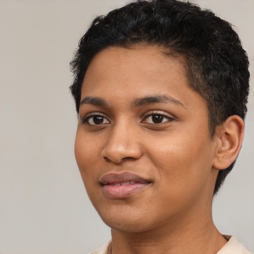 Joyful latino young-adult female with short  black hair and brown eyes