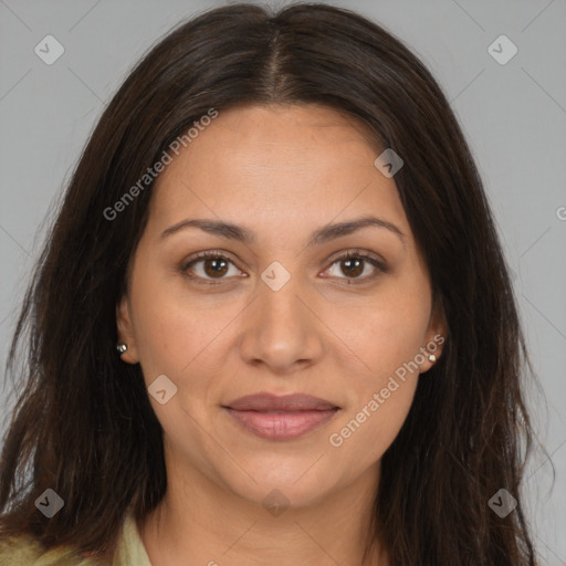 Joyful white adult female with long  brown hair and brown eyes