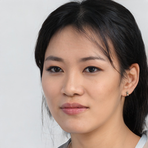 Neutral asian young-adult female with medium  brown hair and brown eyes