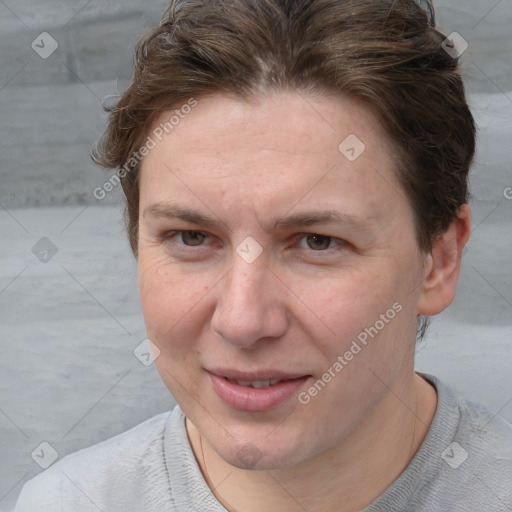 Joyful white adult female with short  brown hair and grey eyes