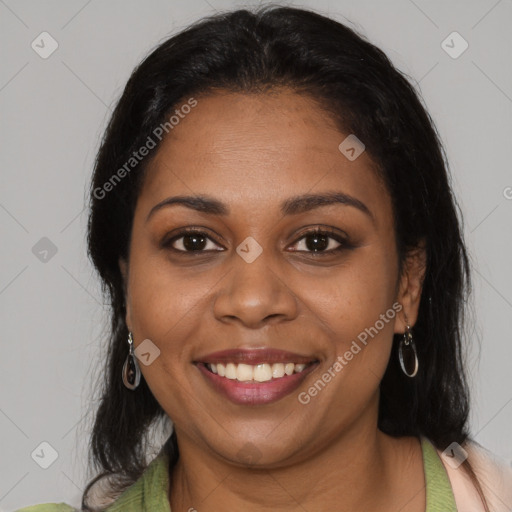 Joyful black young-adult female with medium  brown hair and brown eyes