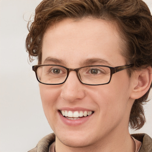 Joyful white adult female with short  brown hair and grey eyes