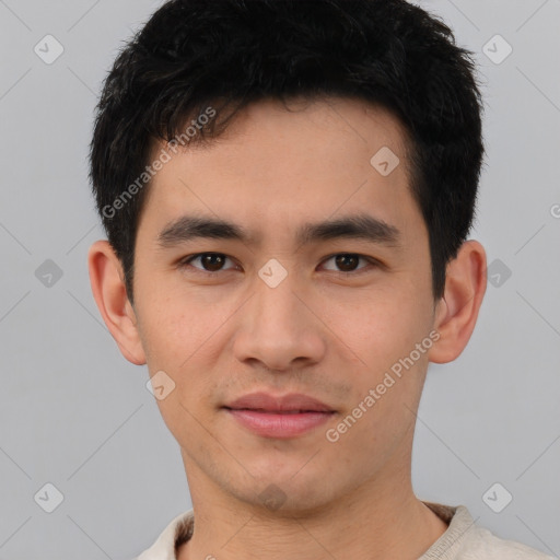 Joyful asian young-adult male with short  black hair and brown eyes