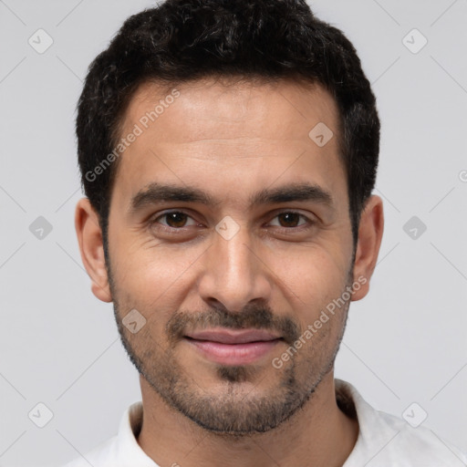 Joyful white young-adult male with short  black hair and brown eyes