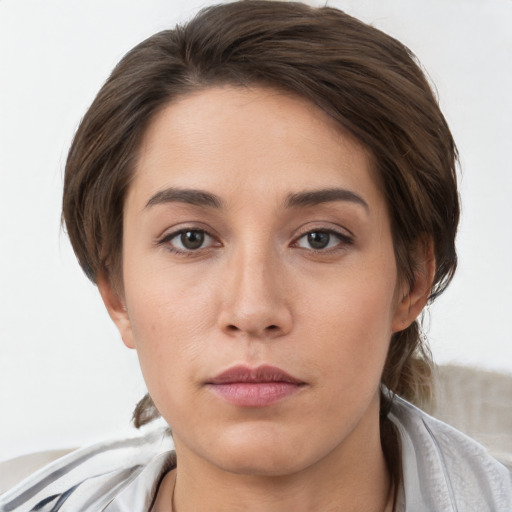 Neutral white young-adult female with short  brown hair and brown eyes