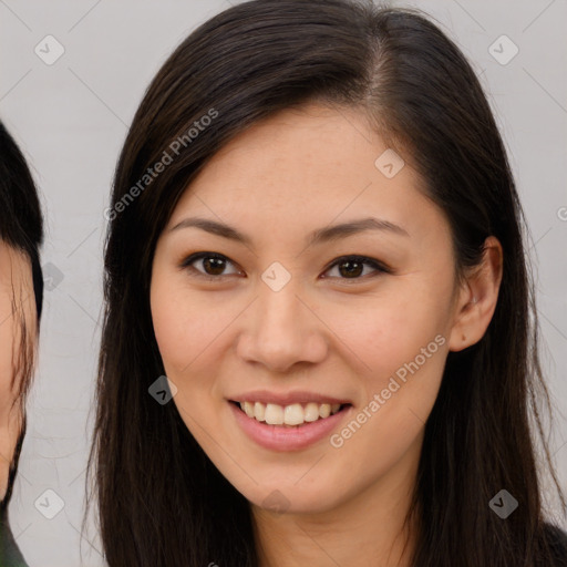 Joyful asian young-adult female with long  brown hair and brown eyes