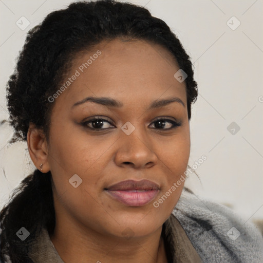 Joyful black young-adult female with long  brown hair and brown eyes