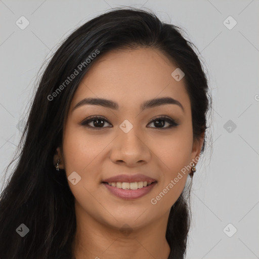 Joyful latino young-adult female with long  brown hair and brown eyes