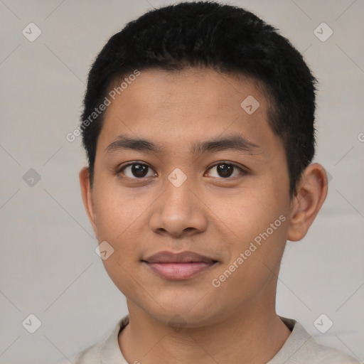 Joyful latino young-adult male with short  black hair and brown eyes