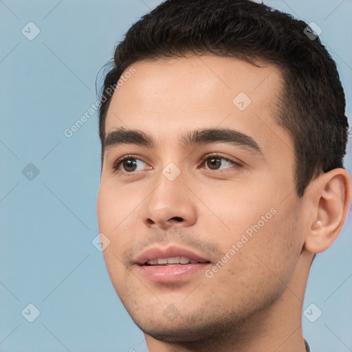 Joyful white young-adult male with short  black hair and brown eyes