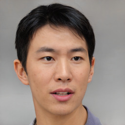 Neutral asian young-adult male with short  brown hair and brown eyes