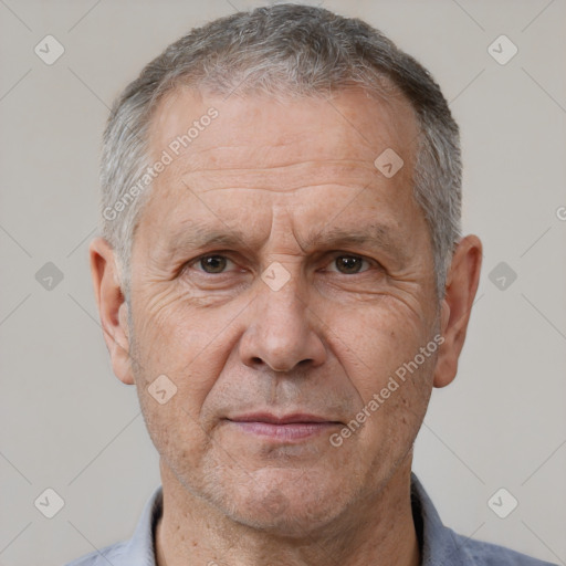 Neutral white middle-aged male with short  gray hair and brown eyes