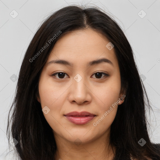 Joyful asian young-adult female with long  brown hair and brown eyes