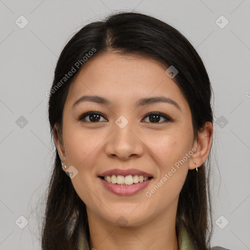 Joyful asian young-adult female with long  brown hair and brown eyes