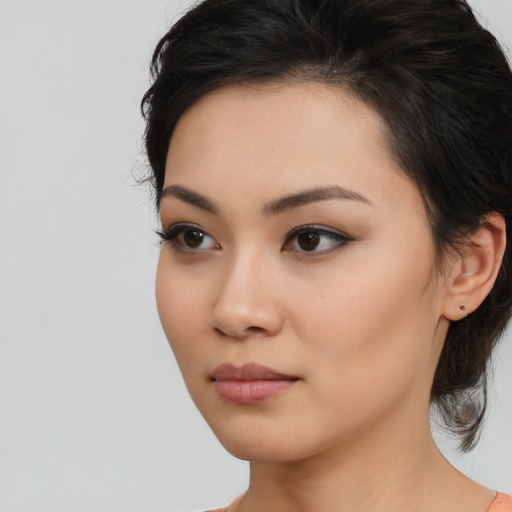 Neutral asian young-adult female with medium  brown hair and brown eyes