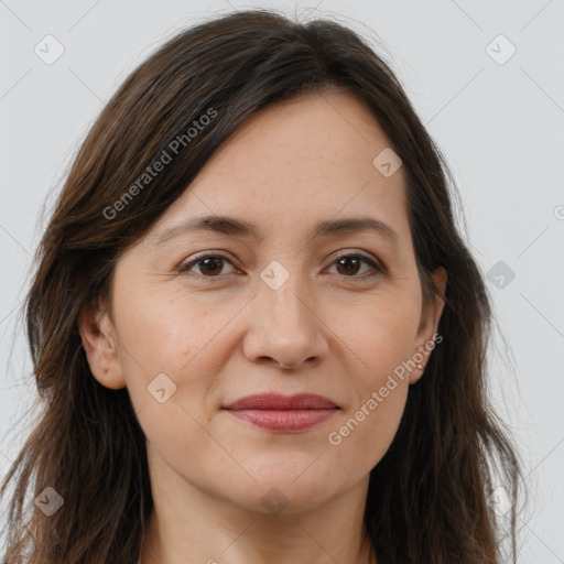 Joyful white adult female with long  brown hair and brown eyes