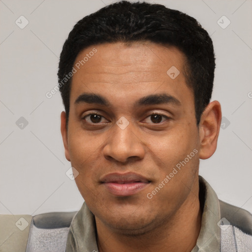 Joyful black young-adult male with short  black hair and brown eyes