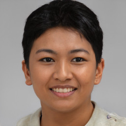 Joyful asian young-adult female with short  black hair and brown eyes