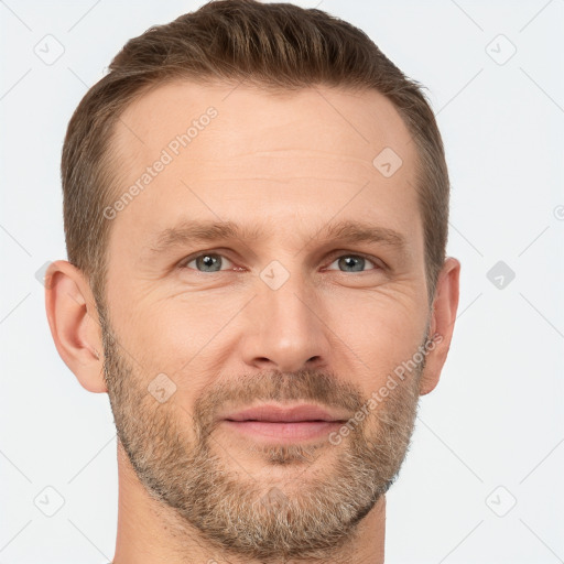 Joyful white adult male with short  brown hair and grey eyes