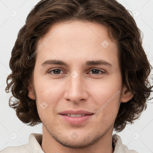 Joyful white young-adult male with medium  brown hair and brown eyes