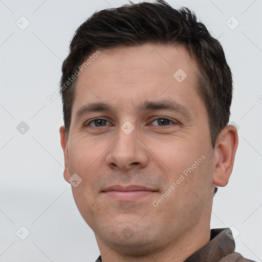 Joyful white young-adult male with short  brown hair and brown eyes