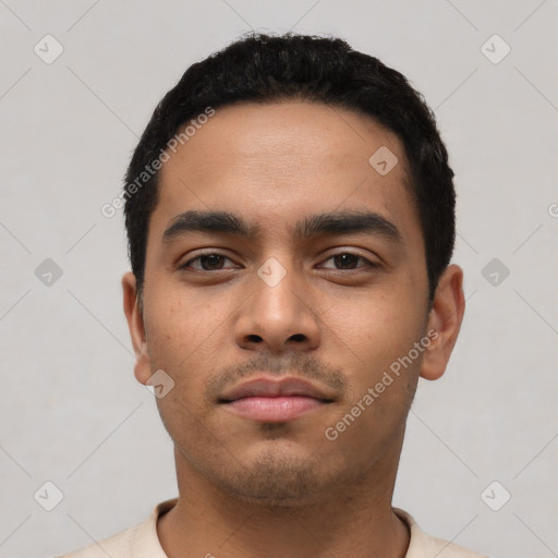 Neutral latino young-adult male with short  black hair and brown eyes