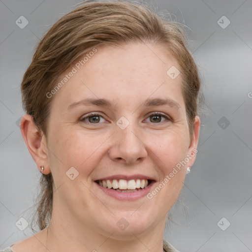 Joyful white adult female with medium  brown hair and grey eyes