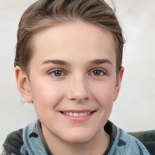 Joyful white child female with short  brown hair and grey eyes