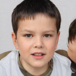 Joyful white child male with short  brown hair and brown eyes