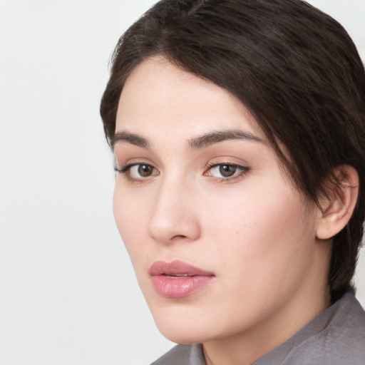 Neutral white young-adult female with medium  brown hair and brown eyes