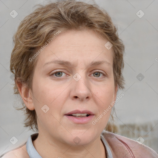 Joyful white adult female with medium  brown hair and blue eyes