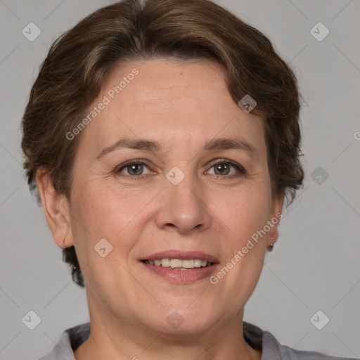 Joyful white adult female with short  brown hair and grey eyes