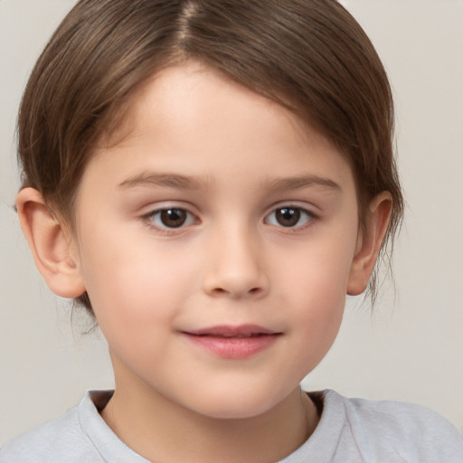 Joyful white child female with short  brown hair and brown eyes