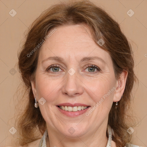 Joyful white adult female with medium  brown hair and grey eyes