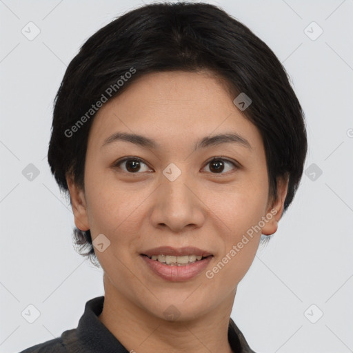 Joyful asian young-adult female with short  black hair and brown eyes