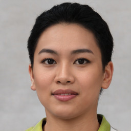 Joyful asian young-adult female with short  black hair and brown eyes