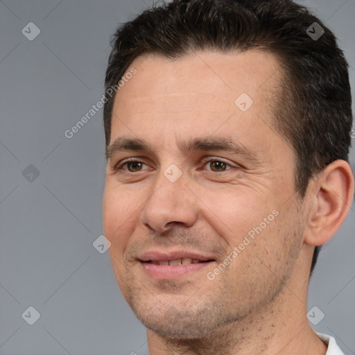 Joyful white adult male with short  brown hair and brown eyes