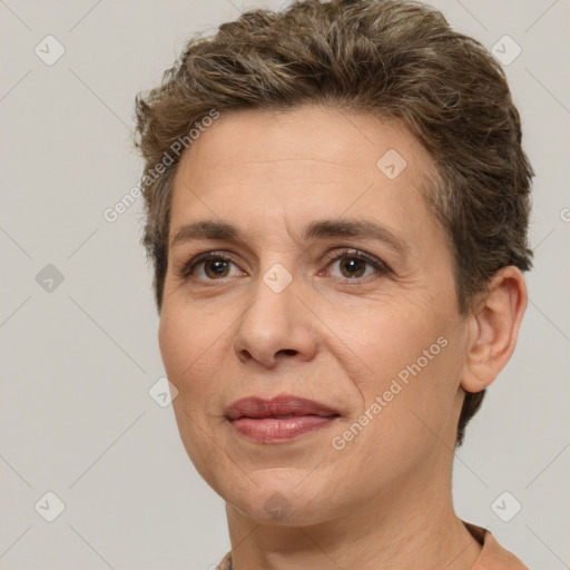 Joyful white adult female with short  brown hair and brown eyes