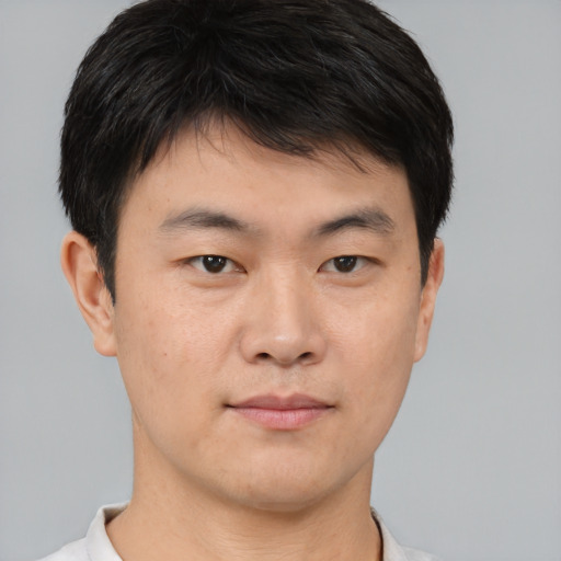 Neutral asian young-adult male with short  brown hair and brown eyes
