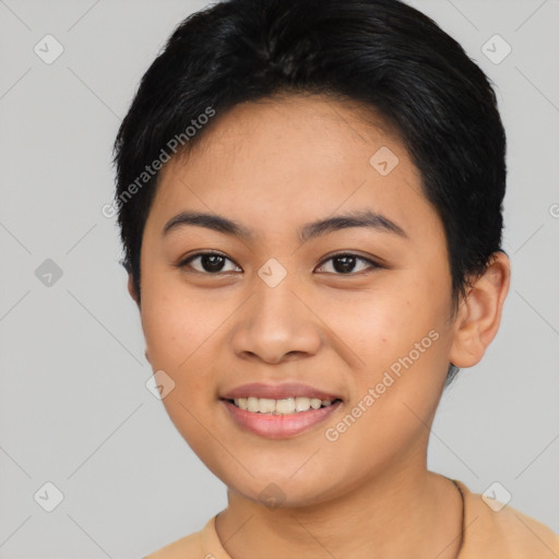 Joyful asian young-adult female with short  black hair and brown eyes