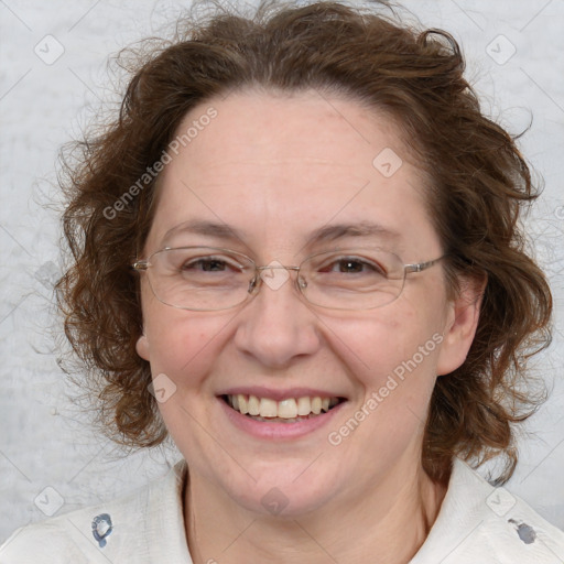 Joyful white adult female with medium  brown hair and blue eyes