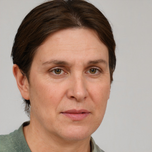 Joyful white adult female with short  brown hair and grey eyes