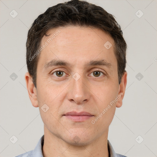 Joyful white adult male with short  brown hair and brown eyes